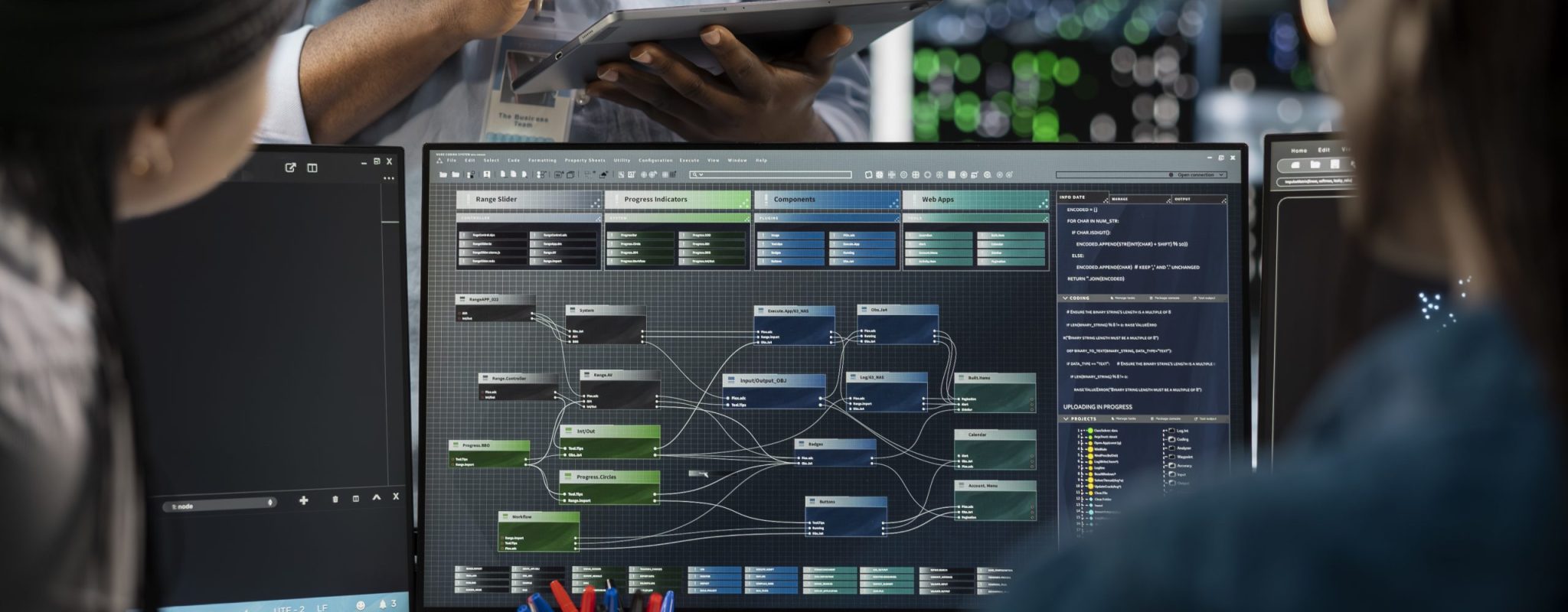 Close up of data center programmers using PC to visualize artificial intelligence neural networks. Server farm IT experts looking at monitor, working together to oversee AI systems